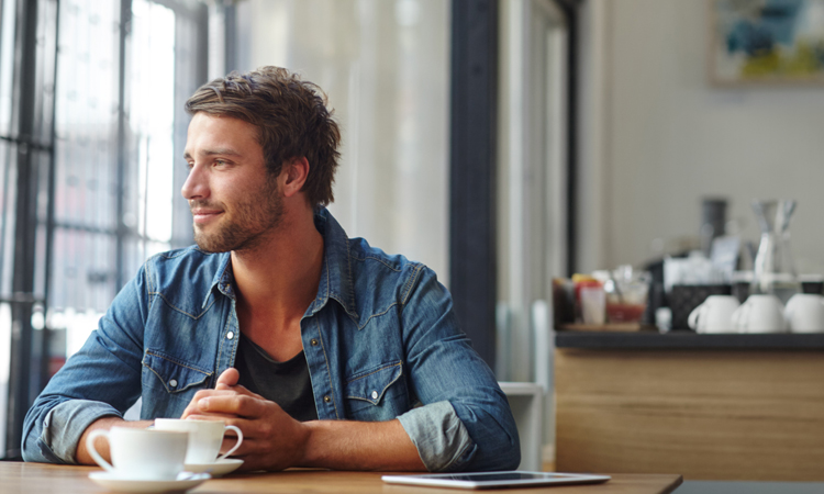 Attitude-of-Gratitude Man looking out coffee shop window