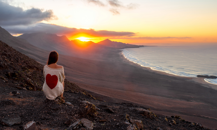 sitting looking at the sunrise