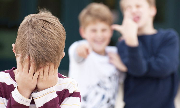 boy bullied by two boys